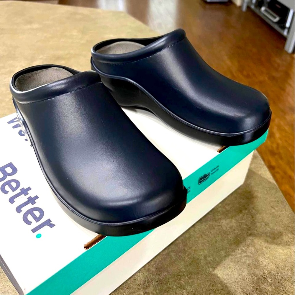 New in box, worn twice. Navy blue.